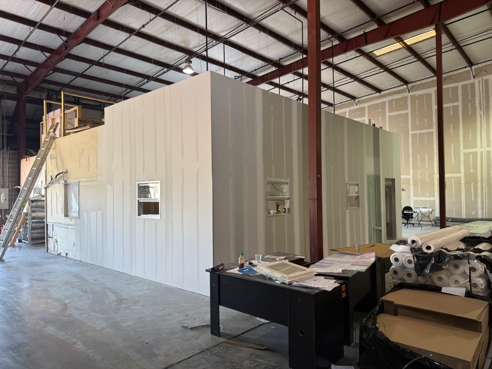 CG Interiors commercial interior buildout in Hendersonville, TN — Builders Insulation office expansion with metal stud framing, drywall, and acoustical ceilings