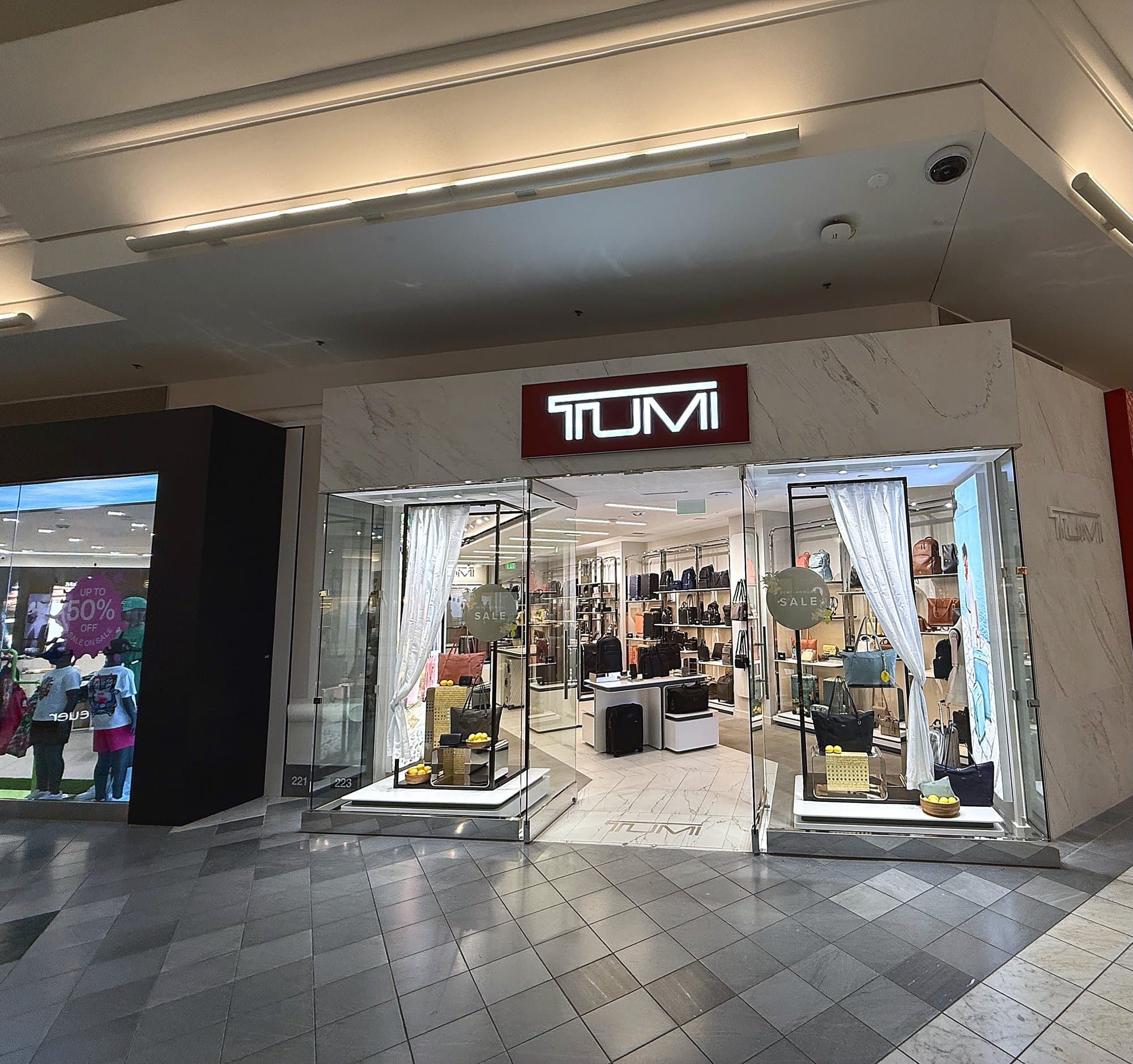 CG Interiors commercial interior buildout — TUMI retail storefront