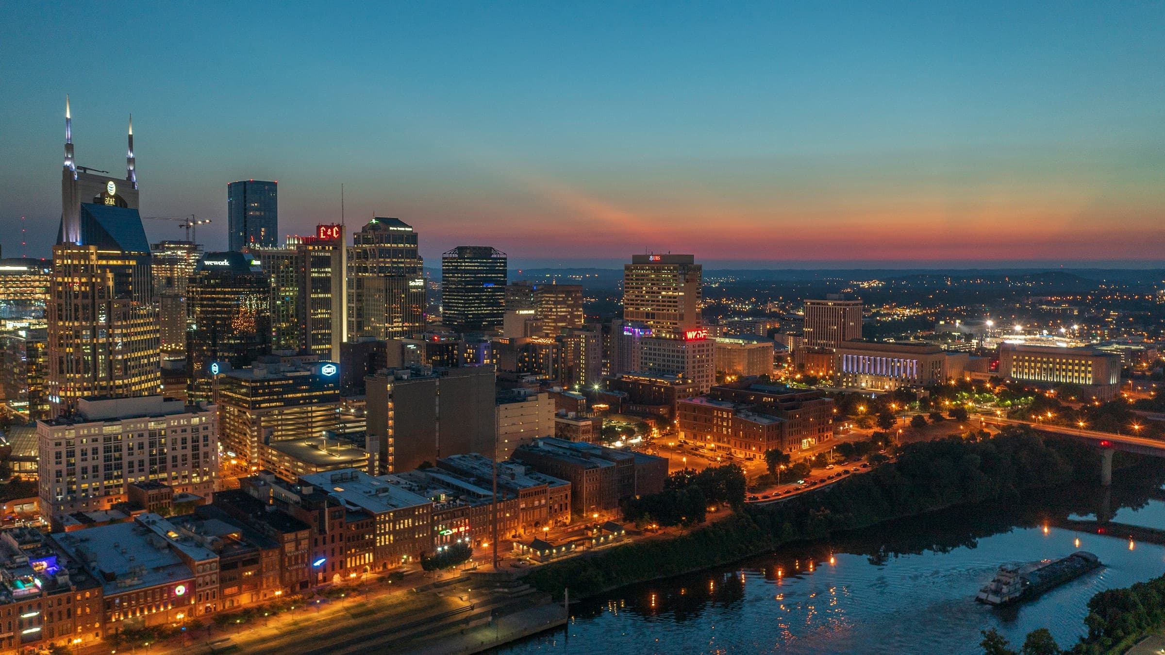 Downtown Nashville skyline at dusk along the Cumberland River