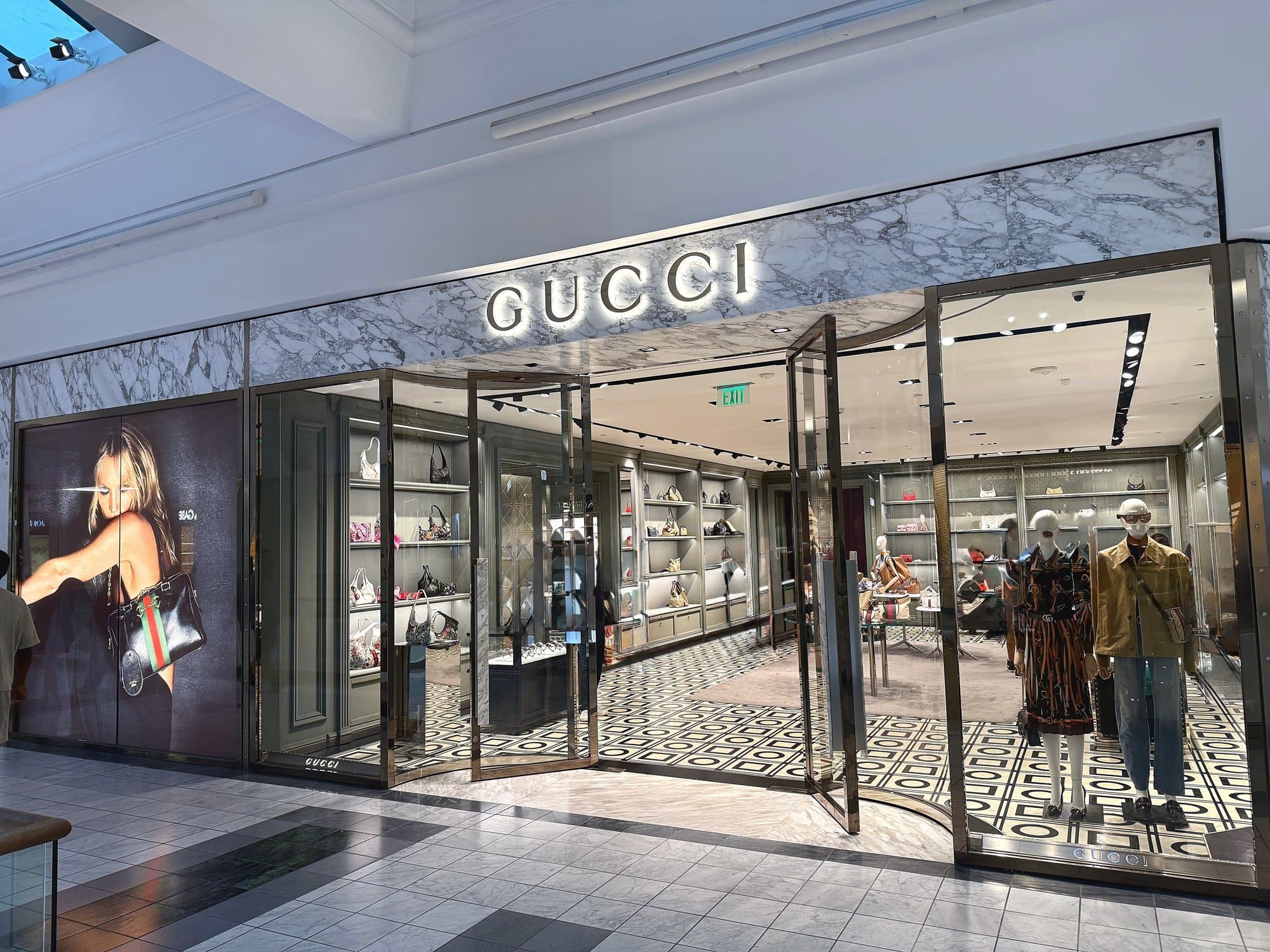 CG Interiors commercial interior buildout — Gucci luxury retail storefront